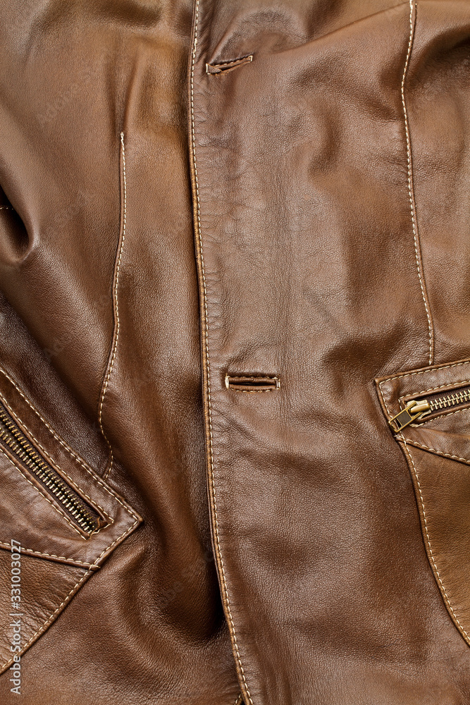 Detail of light brown leather clothing Detail of light brown leather clothing