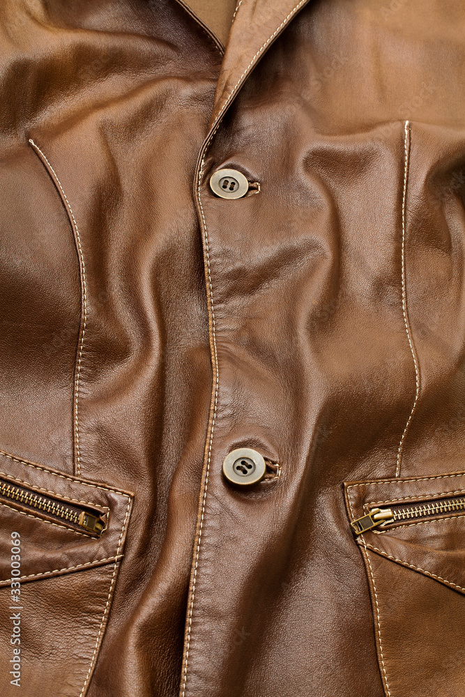 Detail of light brown leather clothing Detail of light brown leather clothing