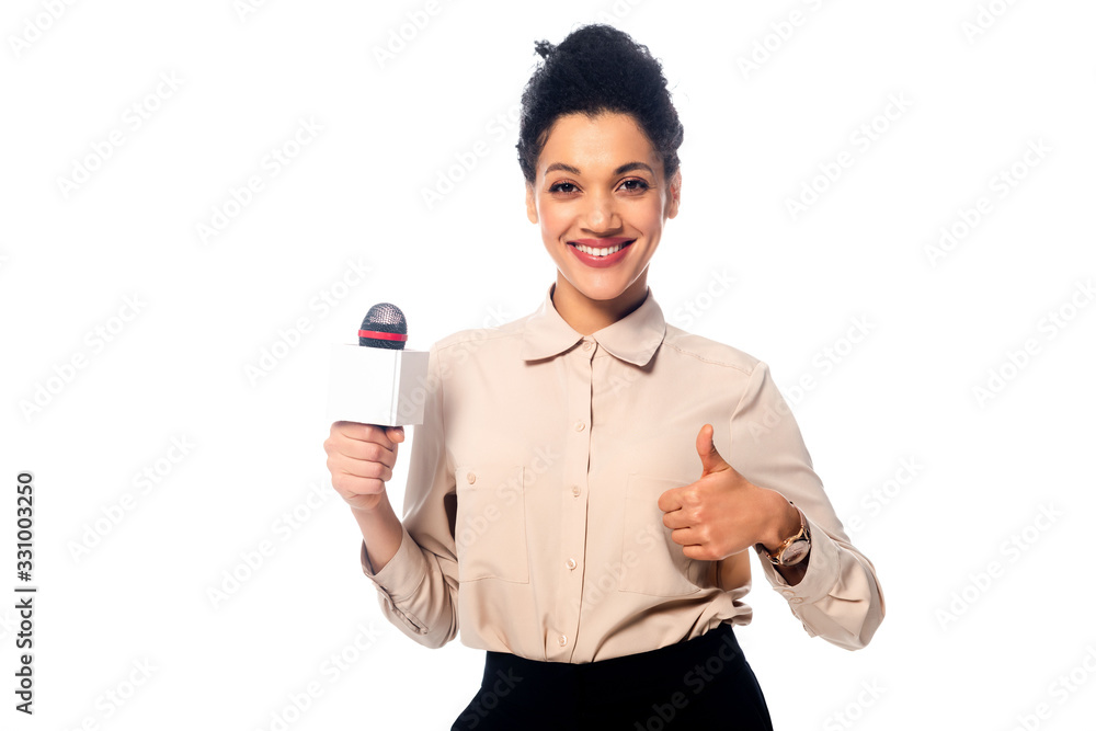 Front view of african american journalist with thumb up holding microphone and smiling isolated on white Front view of african american journalist with thumb up holding microphone and smiling isolated on white