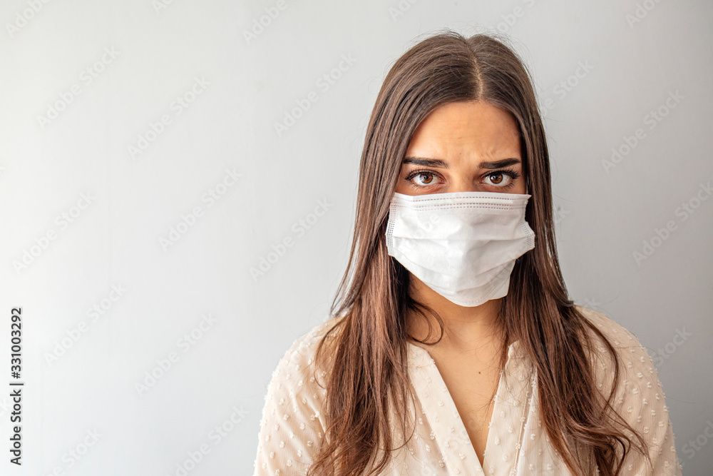 Stop the virus and epidemic diseases. Healthy woman in blue medical protective mask showing gesture stop. Health protection and prevention during flu and infectious outbreak Stop the virus and epidemic diseases. Healthy woman in blue medical protective mask showing gesture stop. Health protection and prevention during flu and infectious outbreak