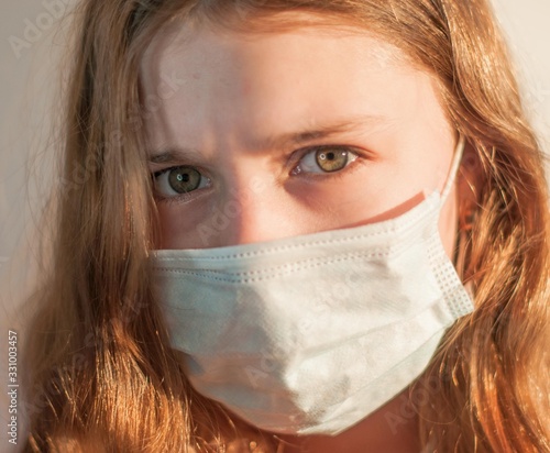 A girl in medical mask