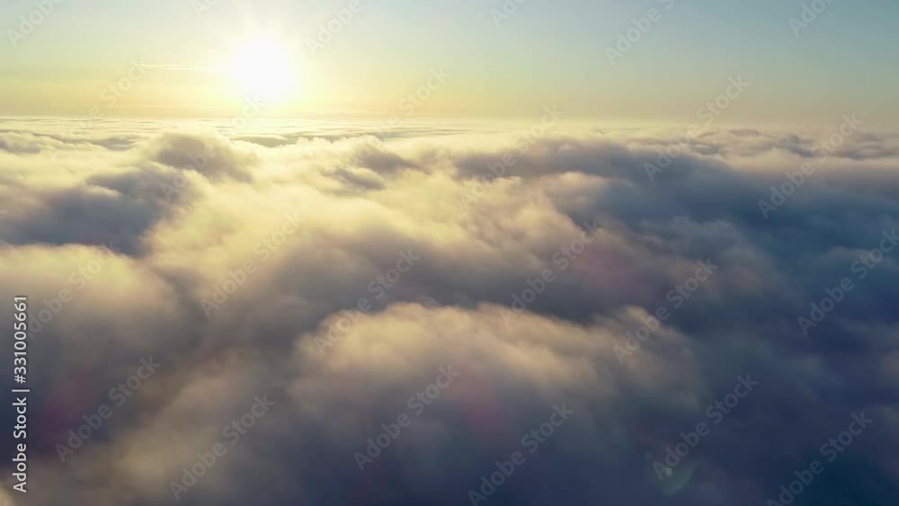 Flying over the evening timelapse clouds with the late sun. Seamlessly looped animation. Flight through moving cloudscape with beautiful sun rays. Perfect for cinema, background, Flying over the evening timelapse clouds with the late sun. Seamlessly looped animation. Flight through moving cloudscape with beautiful sun rays. Perfect for cinema, background,