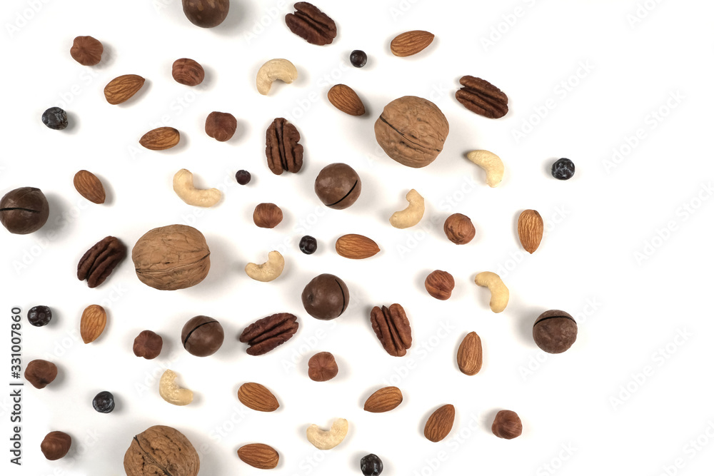 Obraz premium Different nuts on a white background