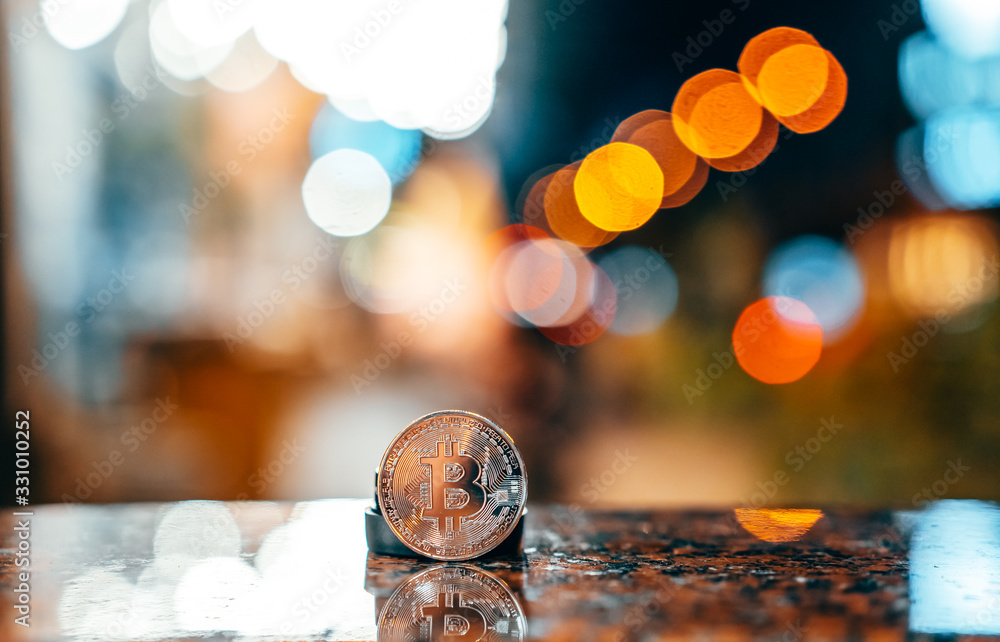 Fototapeta premium Silver bitcoin isolated on the table, glowing background