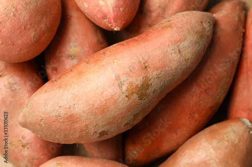 Sweet potato on whole background, close up. Vegetables