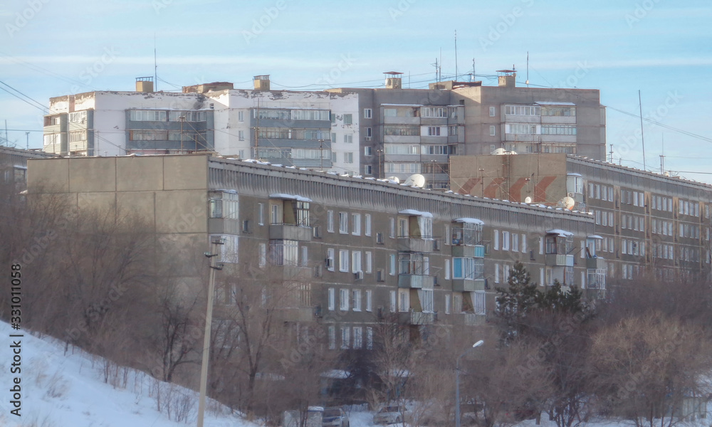 Soviet architecture. Ust-Kamenogorsk (Kazakhstan) Apartment buildings. Soviet architectural style. Residential buildings. Soviet built multistory apartment buildings. Old residential area. Grunge