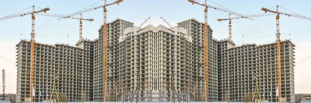 Construction of new residential buildings against the sky . The concept of the construction business .