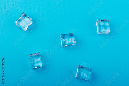 ice cubes in close-up on blue background