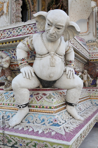 Detail, statue of Wat Pariwat (Beckham's temple) in Bangkok city, Thailand. Religious traditional national Thai architecture. Landmark, sight, architectural monument of Bangkok, Thailand. Asian temple photo