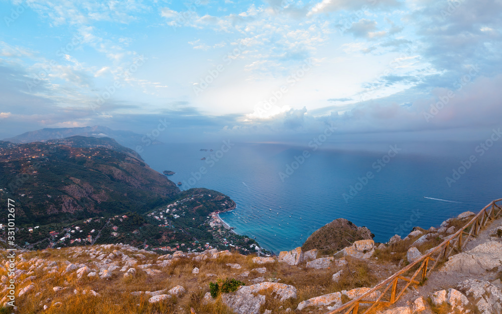 Top of the mountain, aerial view of coastline of the village of Nerano, south Italy shore. Paradise bay. Blue surface of the water, sky and sea. sunset time Vacation and travel concept. Copy space