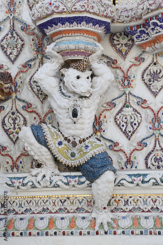 Detail, statue of Wat Pariwat (Beckham's temple) in Bangkok city, Thailand. Religious traditional national Thai architecture. Landmark, sight, architectural monument of Bangkok, Thailand. Asian temple photo