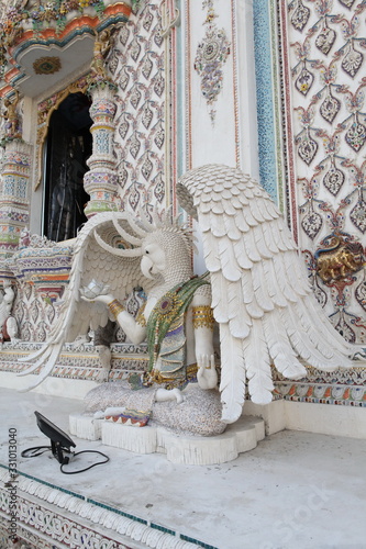 Detail, statue of Wat Pariwat (Beckham's temple) in Bangkok city, Thailand. Religious traditional national Thai architecture. Landmark, sight, architectural monument of Bangkok, Thailand. Asian temple photo