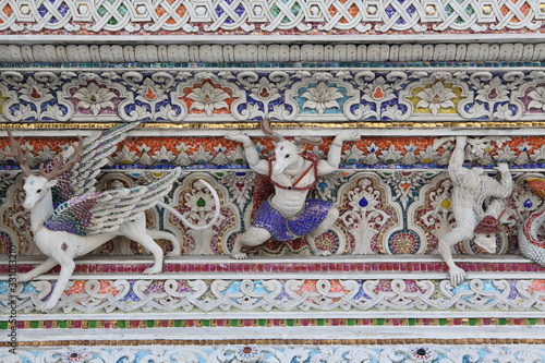 Detail, statue of Wat Pariwat (Beckham's temple) in Bangkok city, Thailand. Religious traditional national Thai architecture. Landmark, sight, architectural monument of Bangkok, Thailand. Asian temple photo