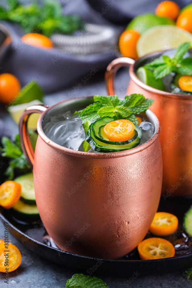 Moscow mule cocktail with lime, mint, cucumber and kumquat Moscow mule cocktail with lime, mint, cucumber and kumquat