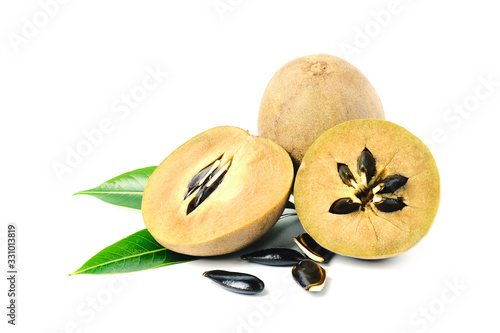 sapodilla fruit with green leaves isolated on the white background photo