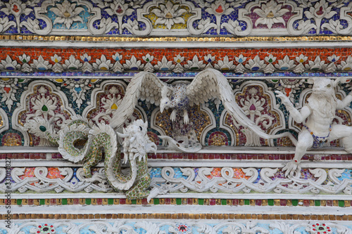 Detail, statue of Wat Pariwat (Beckham's temple) in Bangkok city, Thailand. Religious traditional national Thai architecture. Landmark, sight, architectural monument of Bangkok, Thailand. Asian temple photo