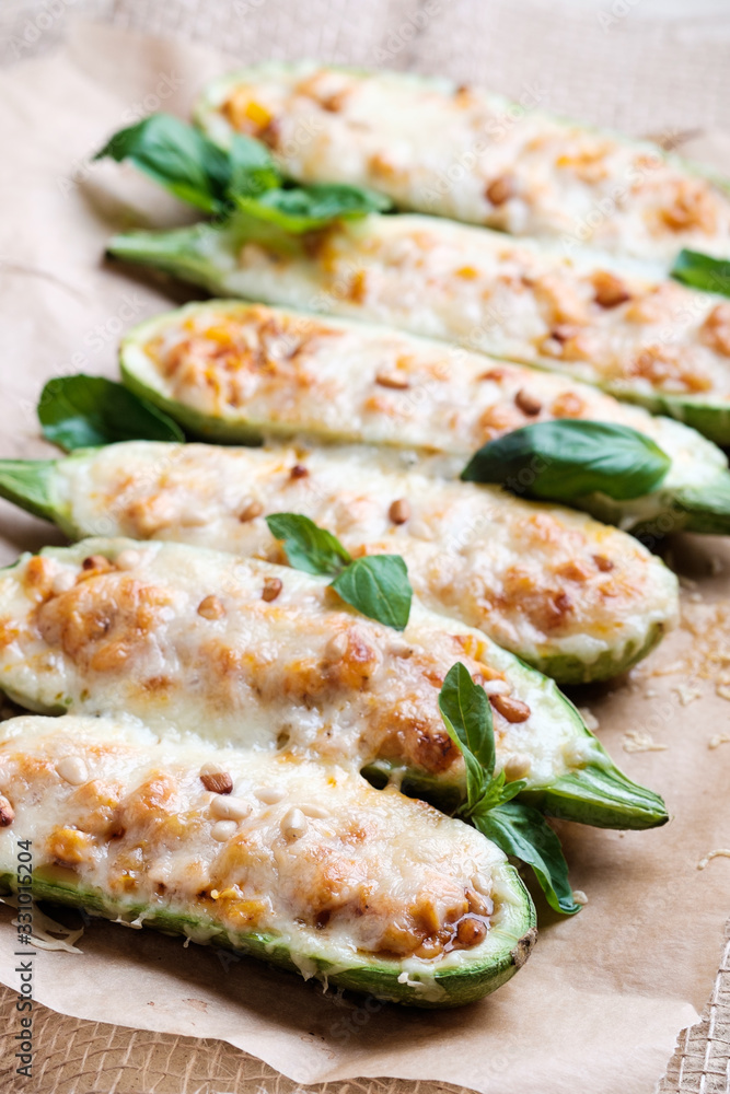 Zucchini baked with cheese and pine nuts