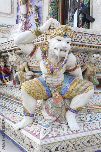 Detail, statue of Wat Pariwat (Beckham's temple) in Bangkok city, Thailand. Religious traditional national Thai architecture. Landmark, sight, architectural monument of Bangkok, Thailand. Asian temple photo