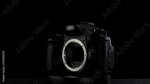 No brand camera on black background. Camera matrix is visible, stand rotation
