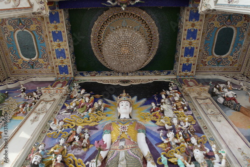 Detail, statue of Wat Pariwat (Beckham's temple) in Bangkok city, Thailand. Religious traditional national Thai architecture. Landmark, sight, architectural monument of Bangkok, Thailand. Asian temple photo