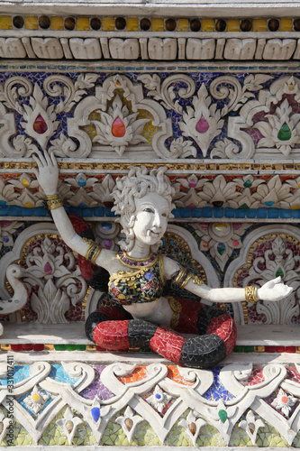 Detail, statue of Wat Pariwat (Beckham's temple) in Bangkok city, Thailand. Religious traditional national Thai architecture. Landmark, sight, architectural monument of Bangkok, Thailand. Asian temple photo