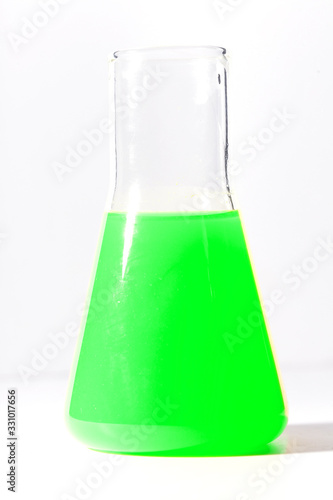 Flask for chemical experiments with green liquid