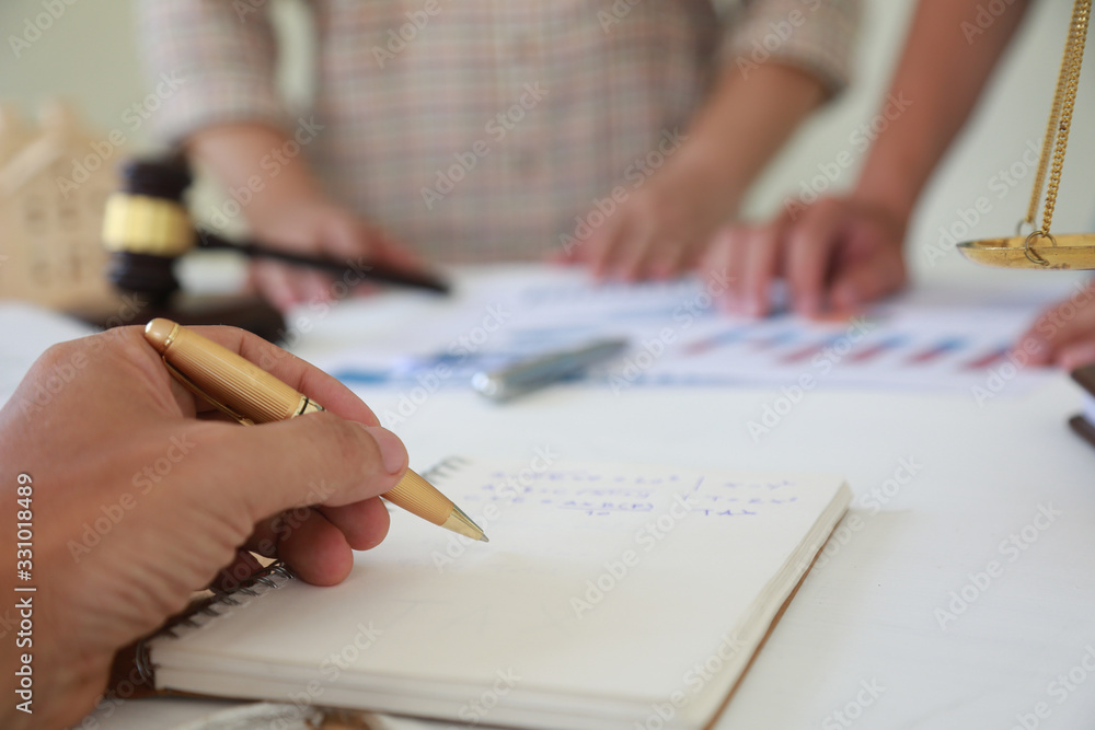 Lawyers are describing the sale transaction of a home sales project.Concepts of law Lawyers are describing the sale transaction of a home sales project.Concepts of law