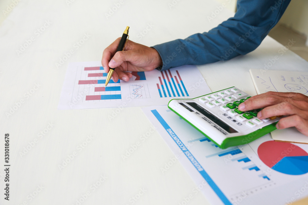 Businessmen are analyzing the cost curve for SME investment. Businessmen are analyzing the cost curve for SME investment.