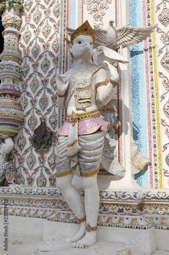 Detail, statue of Wat Pariwat (Beckham's temple) in Bangkok city, Thailand. Religious traditional national Thai architecture. Landmark, sight, architectural monument of Bangkok, Thailand. Asian temple photo