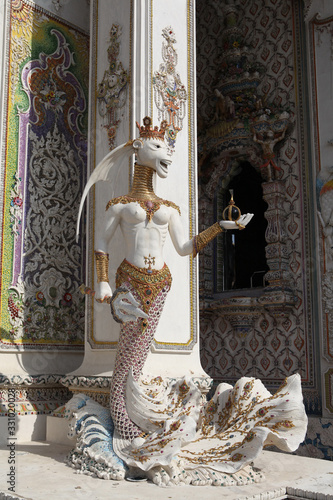 Detail, statue of Wat Pariwat (Beckham's temple) in Bangkok city, Thailand. Religious traditional national Thai architecture. Landmark, sight, architectural monument of Bangkok, Thailand. Asian temple photo