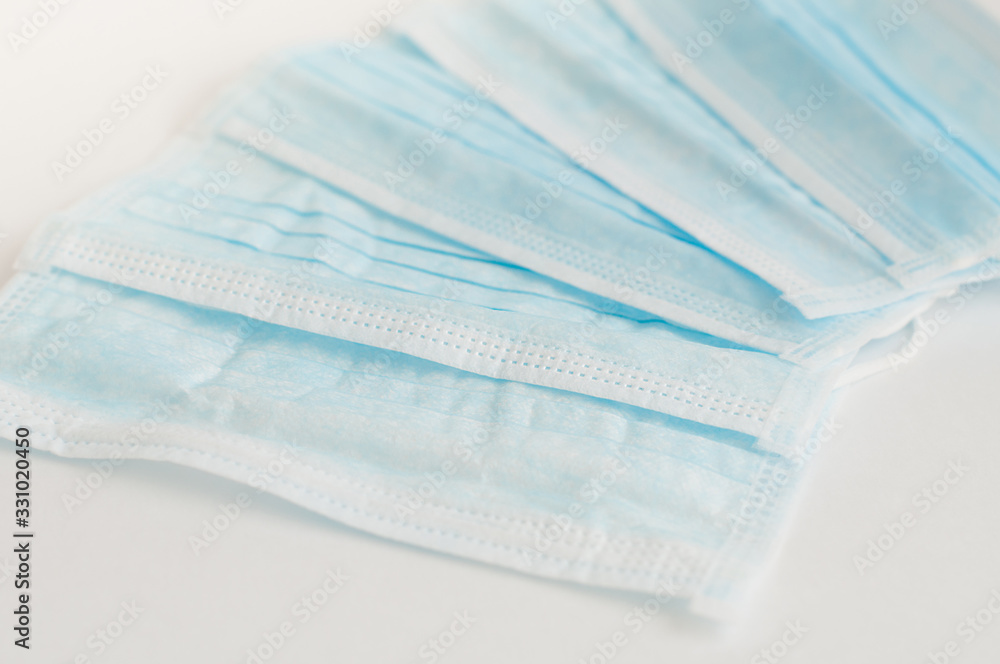 Pile of blue medical masks. Prevention of the spread of virus and epidemic. Pile of blue medical masks. Prevention of the spread of virus and epidemic.