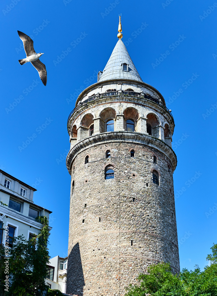 Galata Kulesi Tower in Istanbul, Turkey. Ancient Turkish famous landmark in Beyoglu district, European side of the city. Architecture of the former Constantinople.A historical place  made by Genoese