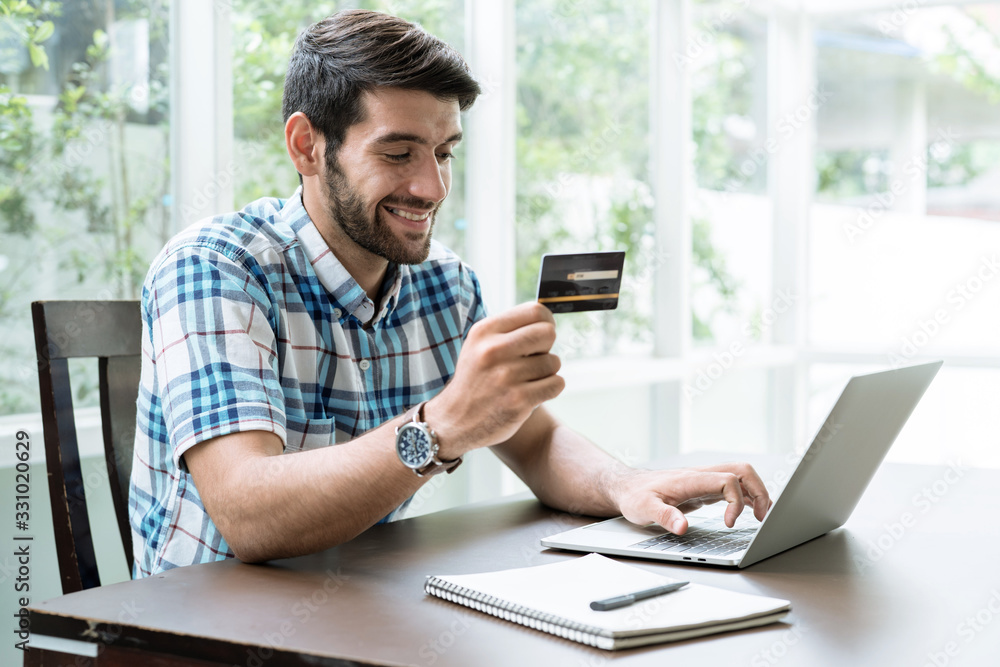 Business and financial concepts, Young men buy goods and make financial transactions online. Business and financial concepts, Young men buy goods and make financial transactions online.
