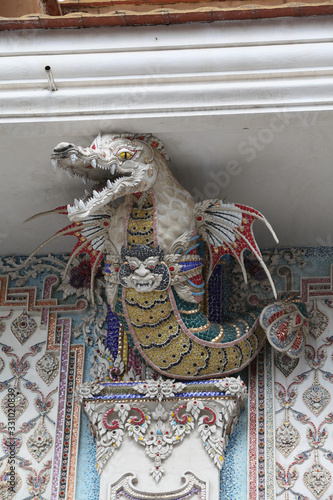 Detail, statue of Wat Pariwat (Beckham's temple) in Bangkok city, Thailand. Religious traditional national Thai architecture. Landmark, sight, architectural monument of Bangkok, Thailand. Asian temple photo