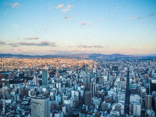 Beautiful aerial view of Nagoya city in Japan with tall buildings and blue skies © Wathanachai