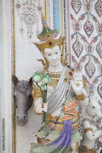 Detail, statue of Wat Pariwat (Beckham's temple) in Bangkok city, Thailand. Religious traditional national Thai architecture. Landmark, sight, architectural monument of Bangkok, Thailand. Asian temple photo