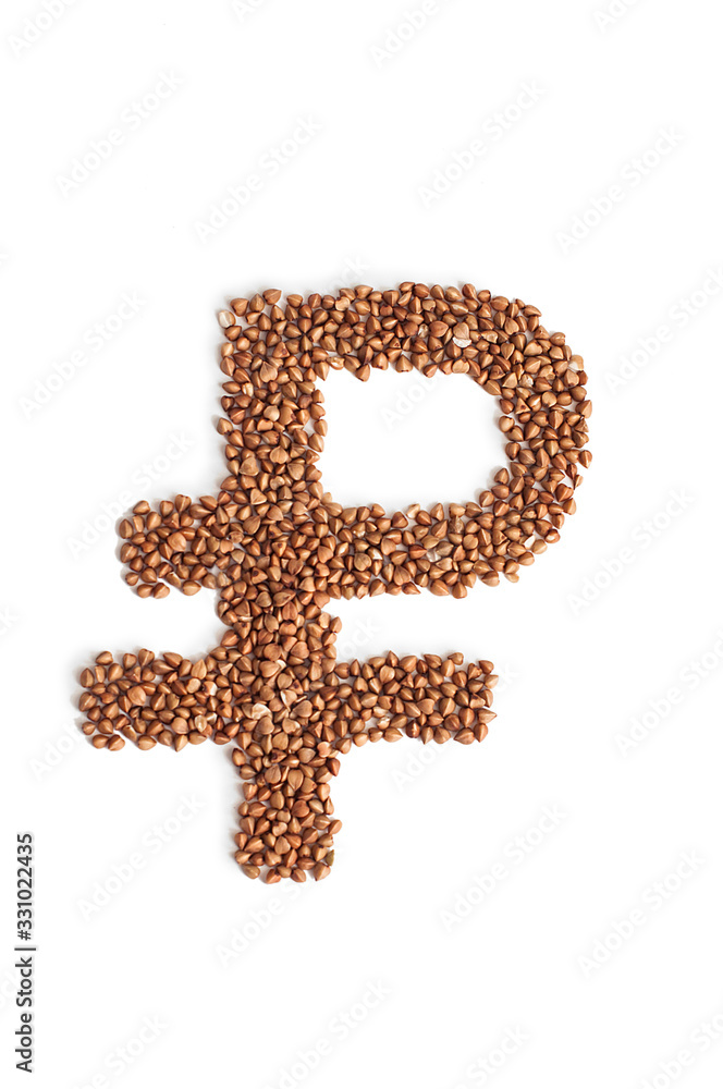 Russian rouble sign made of Buckwheat grains on white background. Russian rouble sign made of Buckwheat grains on white background.