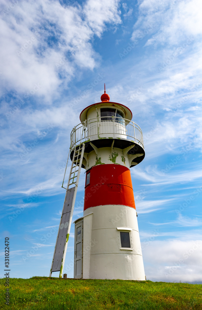Colorful lighthouse on a beautiful summer day