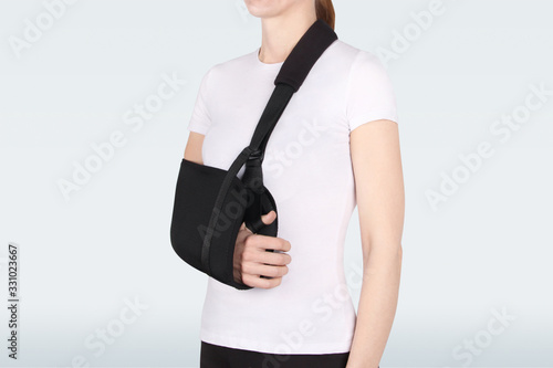 Shoulder Joint Brace. Bandage on the shoulder joint (scarf) with additional fixation. Deso's Handwrap. Supports & Immobilizers. Orthopedic medical Braces. Shoulder injury. photo