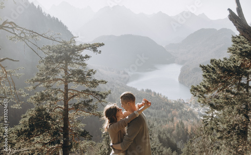 man and woman looking at mountains