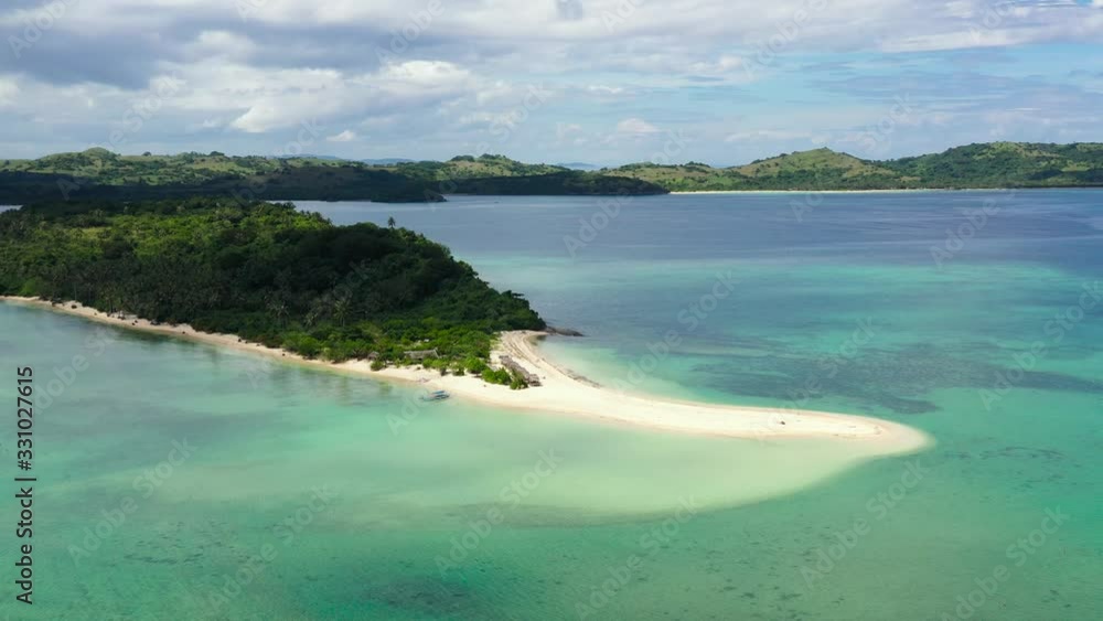 Tropical island with a lagoon and white sandy beach. Caramoan Islands, Philippines. Beautiful islands, view from above. Summer and travel vacation concept. Cotivas Island Tropical island with a lagoon and white sandy beach. Caramoan Islands, Philippines. Beautiful islands, view from above. Summer and travel vacation concept. Cotivas Island