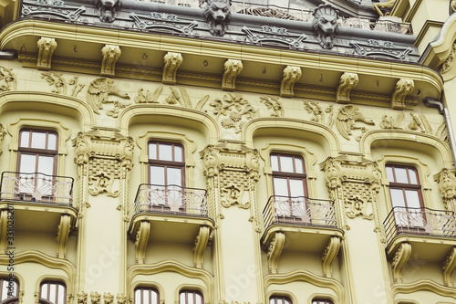 Gray roof and green facade of the building with beautiful architecture photo