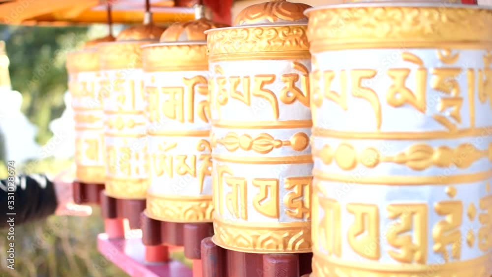 Golden prayer wheels typical of Buddhist temples.