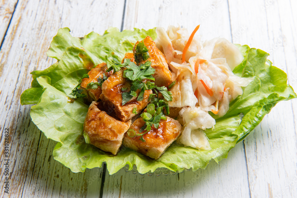 Stinky tofu is a Chinese form of fermented tofu that has a strong odor. Stock Photo Adobe Stock