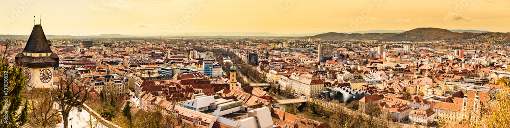 Panoramic view at Graz city with his famous buildings. River mur, clock tower, art museum, town hall.