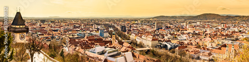 Panoramic view at Graz city with his famous buildings. River mur, clock tower, art museum, town hall.