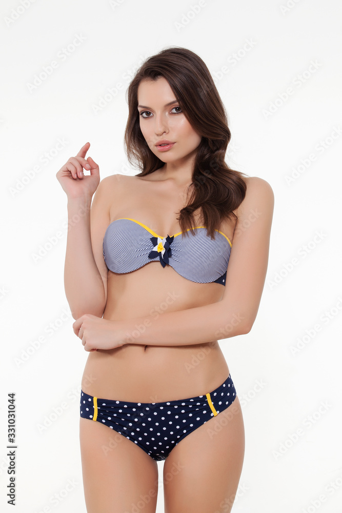 beautiful girl posing in stylish designed chic bikini on white background. beautiful girl posing in stylish designed chic bikini on white background.