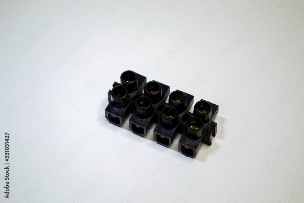 Terminal blocks for electric cables. Shot of electric connector isolated on white background. Terminal blocks for electric cables. Shot of electric connector isolated on white background.