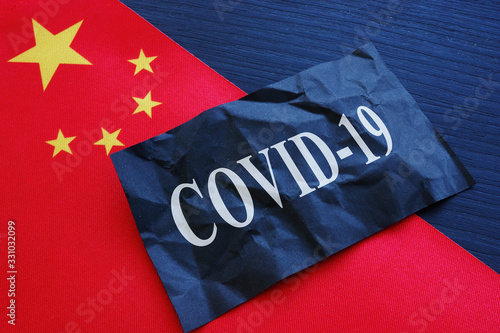 China flag and covid 19 coronavirus sign as symbol of wuhan chinese flu.