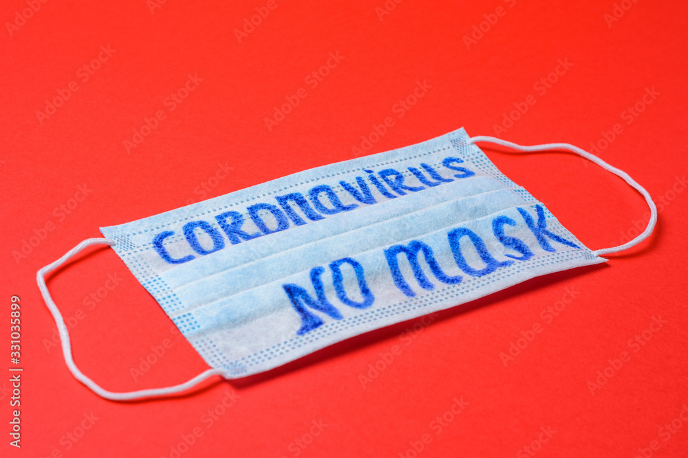 inscription coronavirus on mask, inscription no masks on red background. inscription coronavirus on mask, inscription no masks on red background.